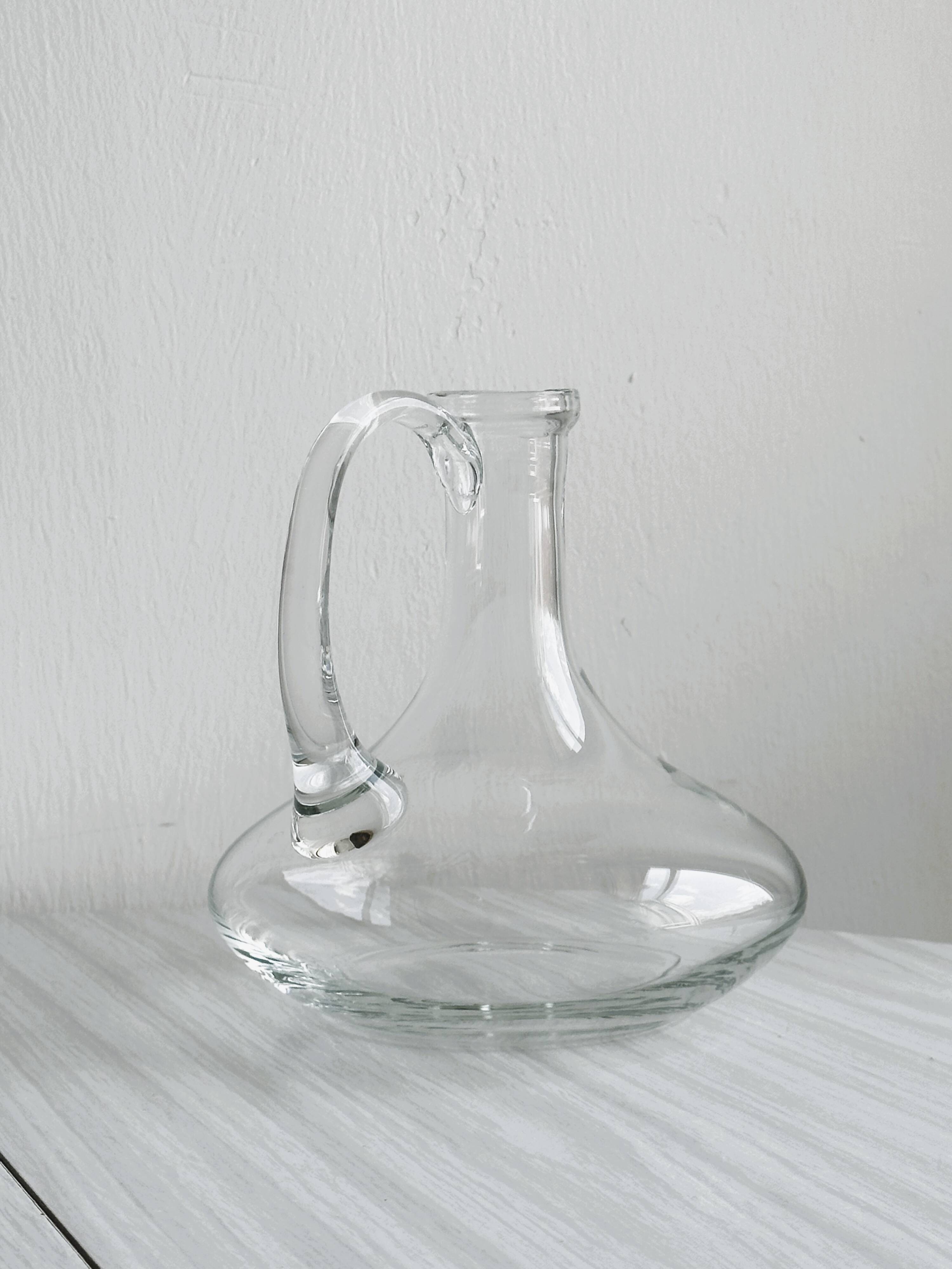Mouth-blown glass carafe, old glassware.