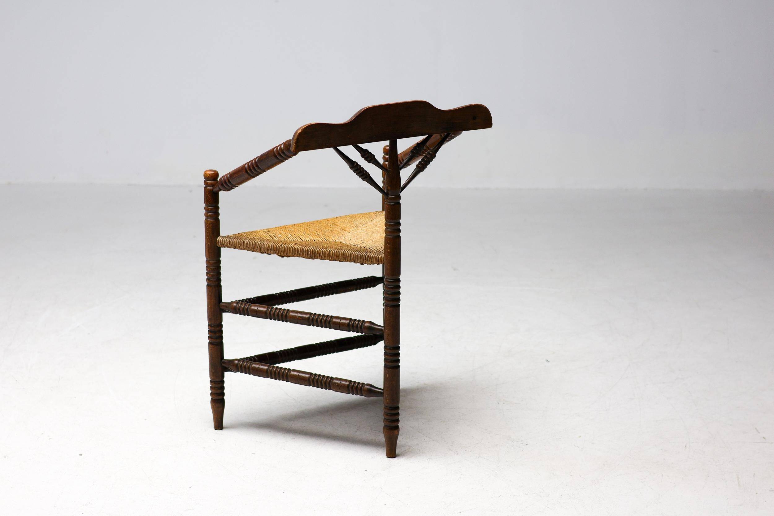 Mid Century Antiques spindle wood chaise with a rush seat.
