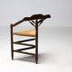 Mid Century Antiques spindle wood chaise with a rush seat.