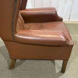 Pair of brown leather wingback Chesterfield armchairs from the 1970s.