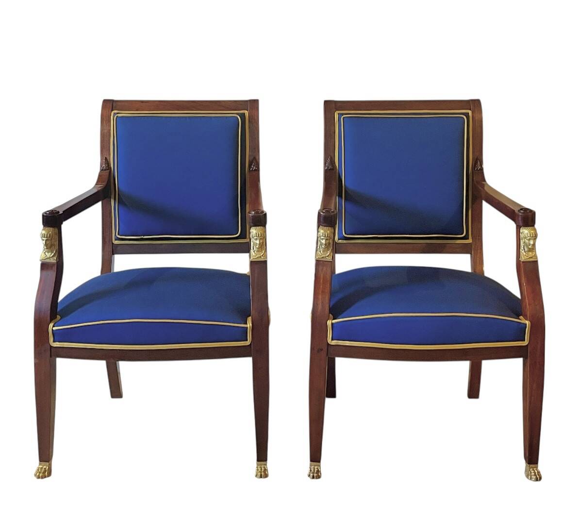 Pair of Empire style armchairs in mahogany and gilt bronze.