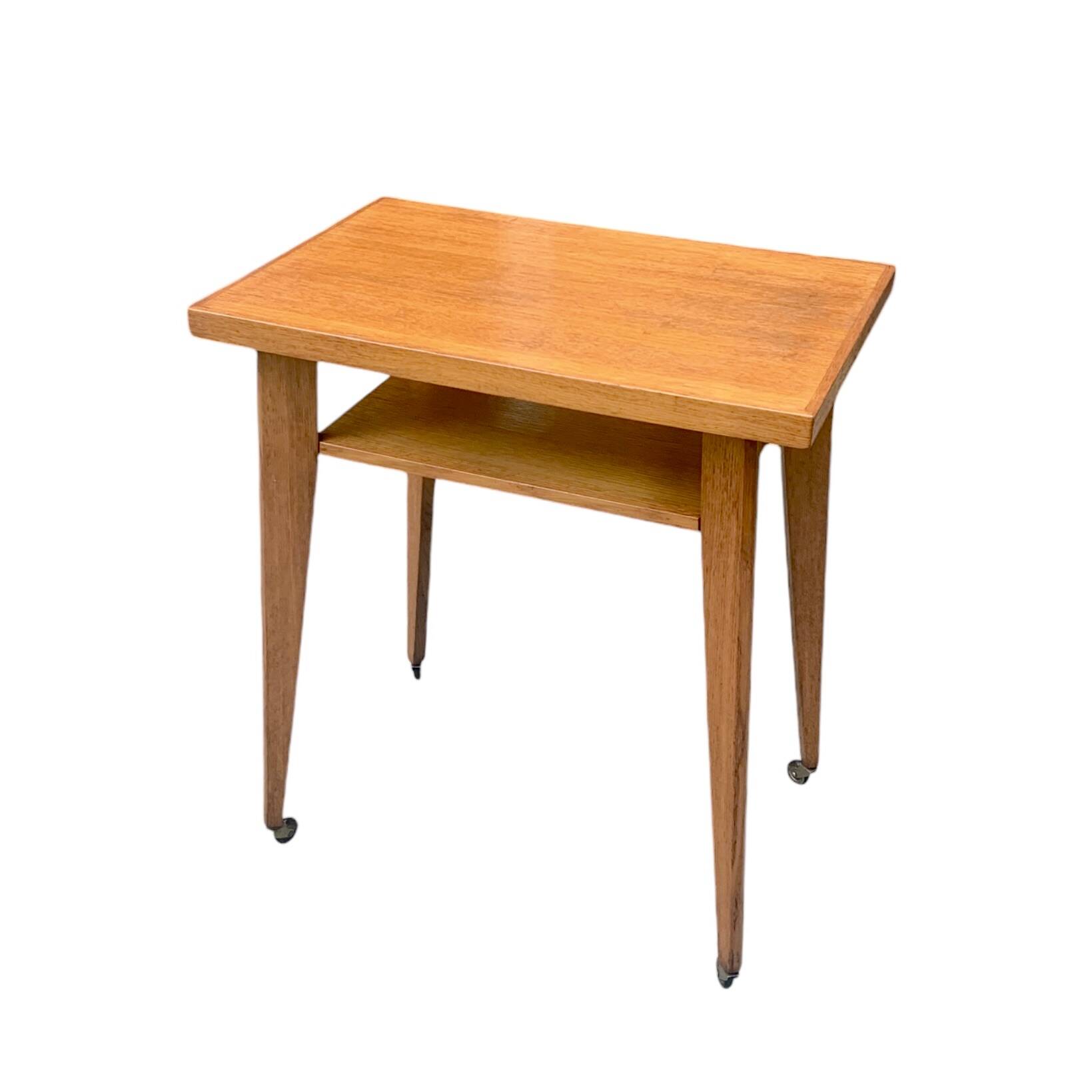 Varnished wooden trolley on wheels