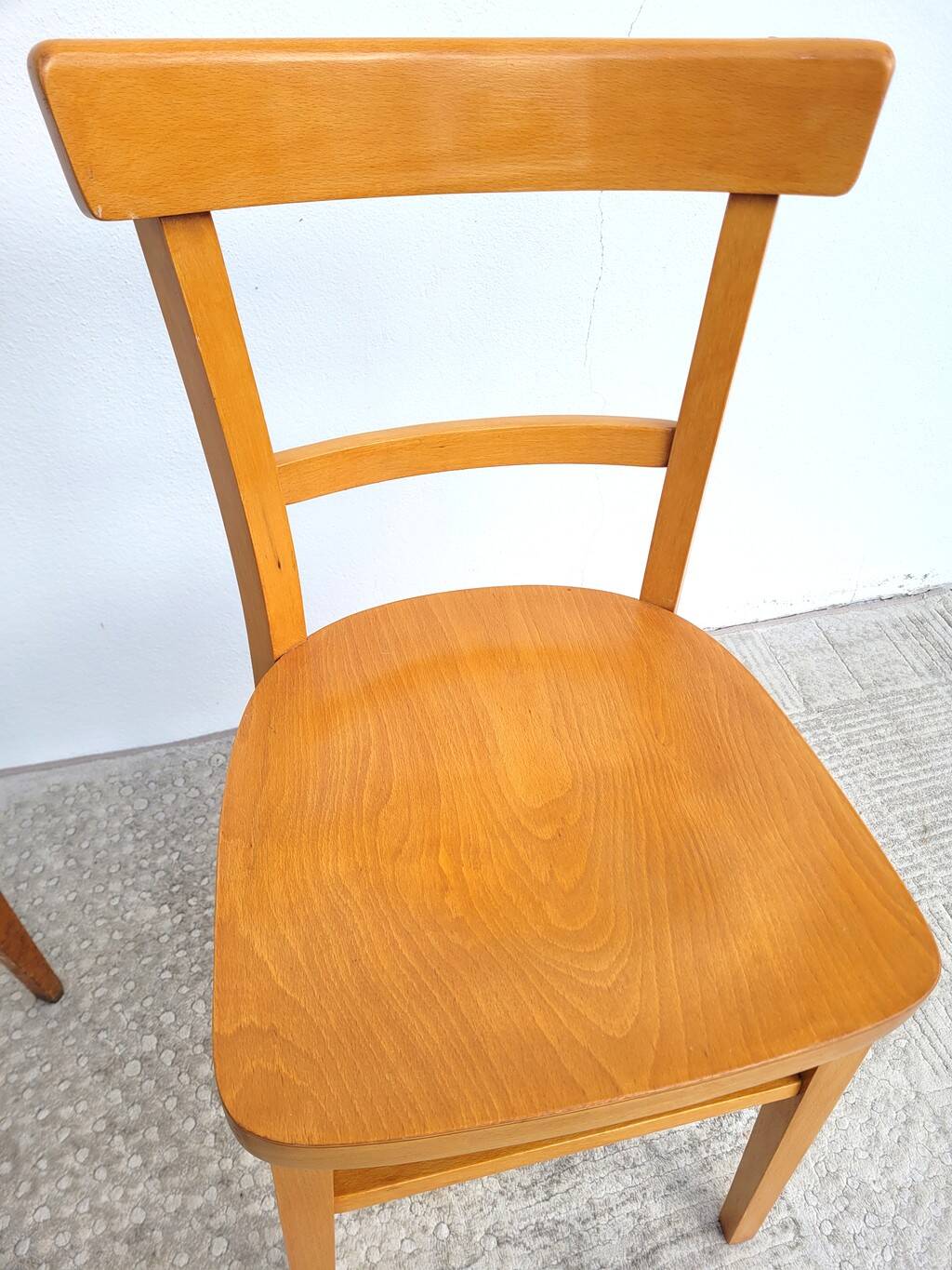 Pair of bistro chairs, one Thonet.