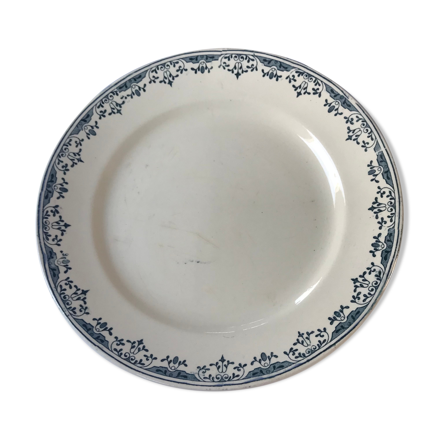 Round serving dish from the Longchamp earthenware factory, Doria model. Iron Land