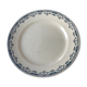 Round serving dish from the Longchamp earthenware factory, Doria model. Iron Land