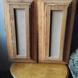 Pair of framed paintings featuring a composition of flowers.