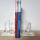 Pair of column bookends in plexiglass and gold metal, 1980s design.