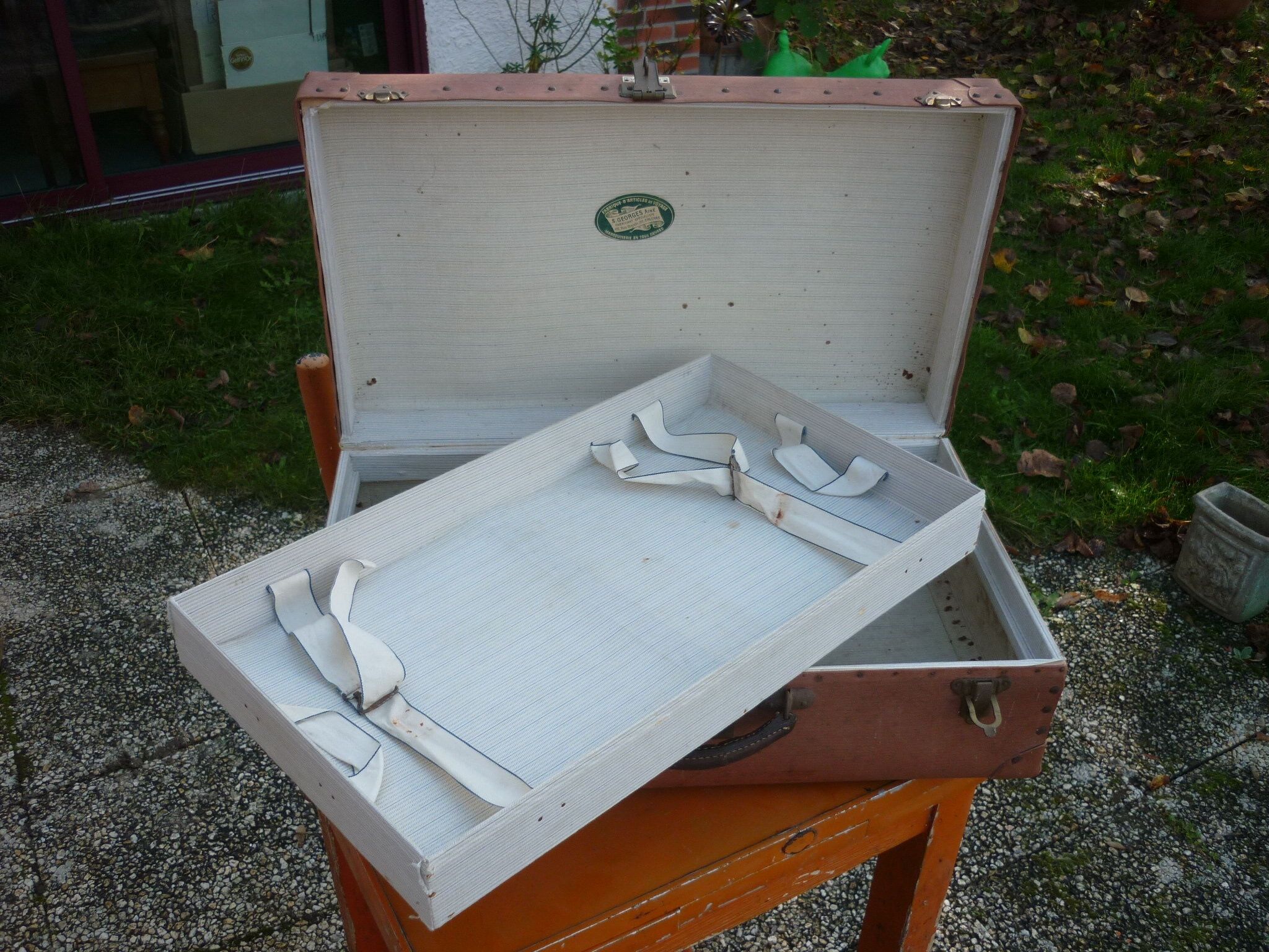 Green cardboard suitcase