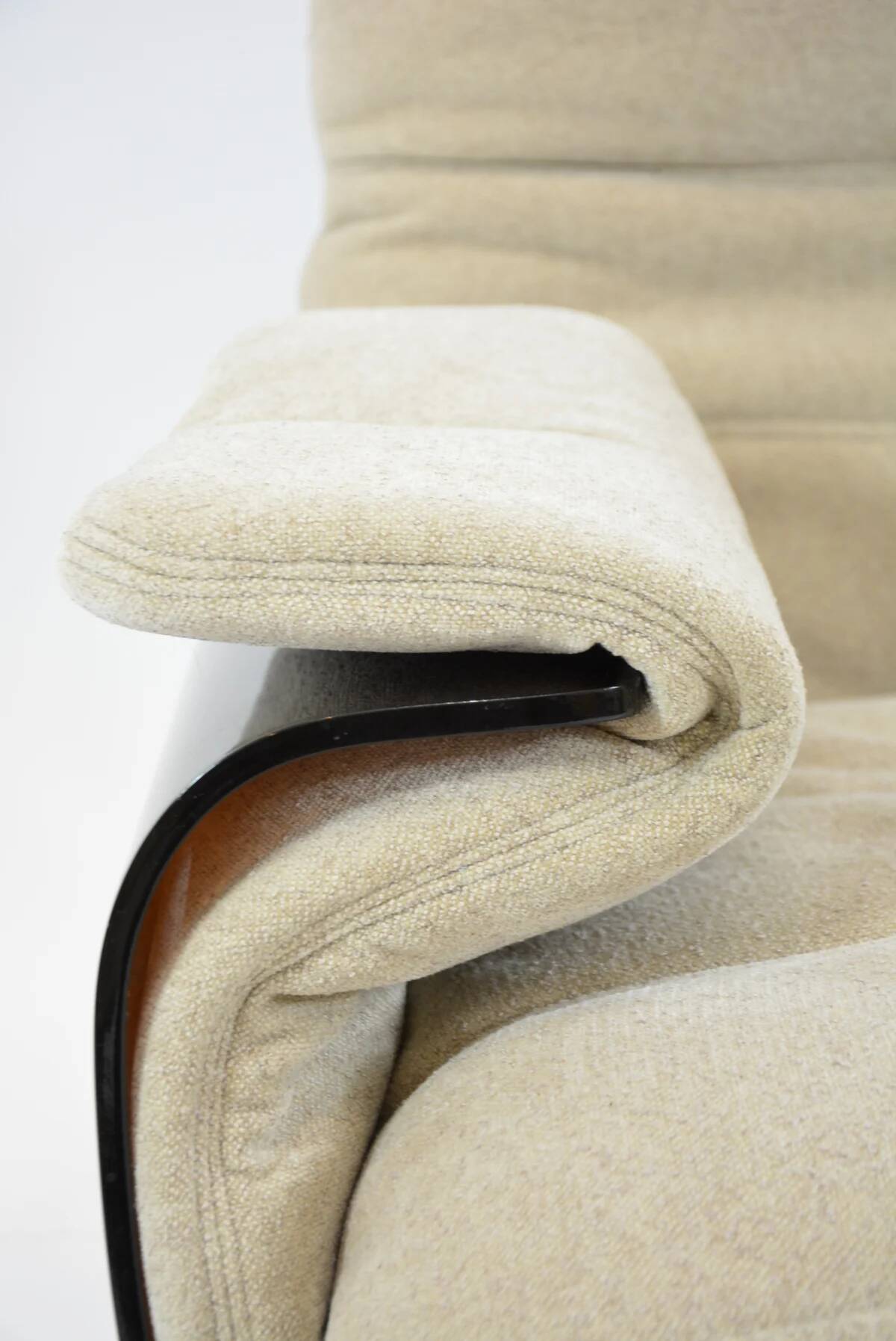 Marsala armchair and its light beige Ligne Roset footrest.