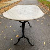 Table de bistrot marbre ovale et acier noire pétrole 4 couverts 140cm