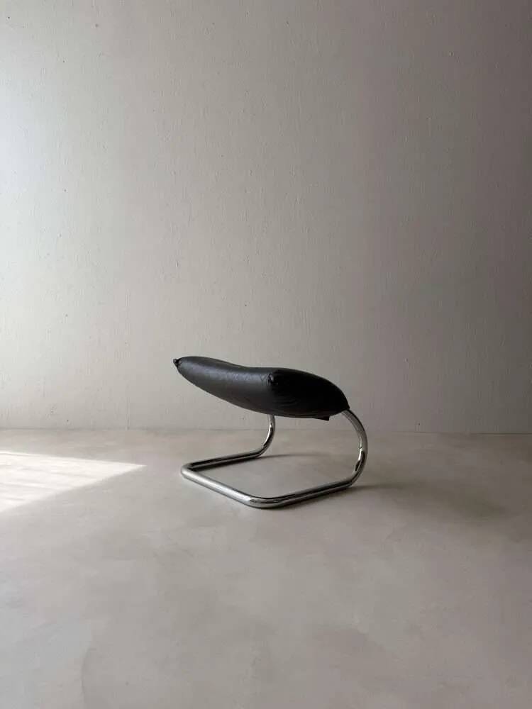 Swiss lounge chair with ottoman by Robert Haussmann from the 1980s.