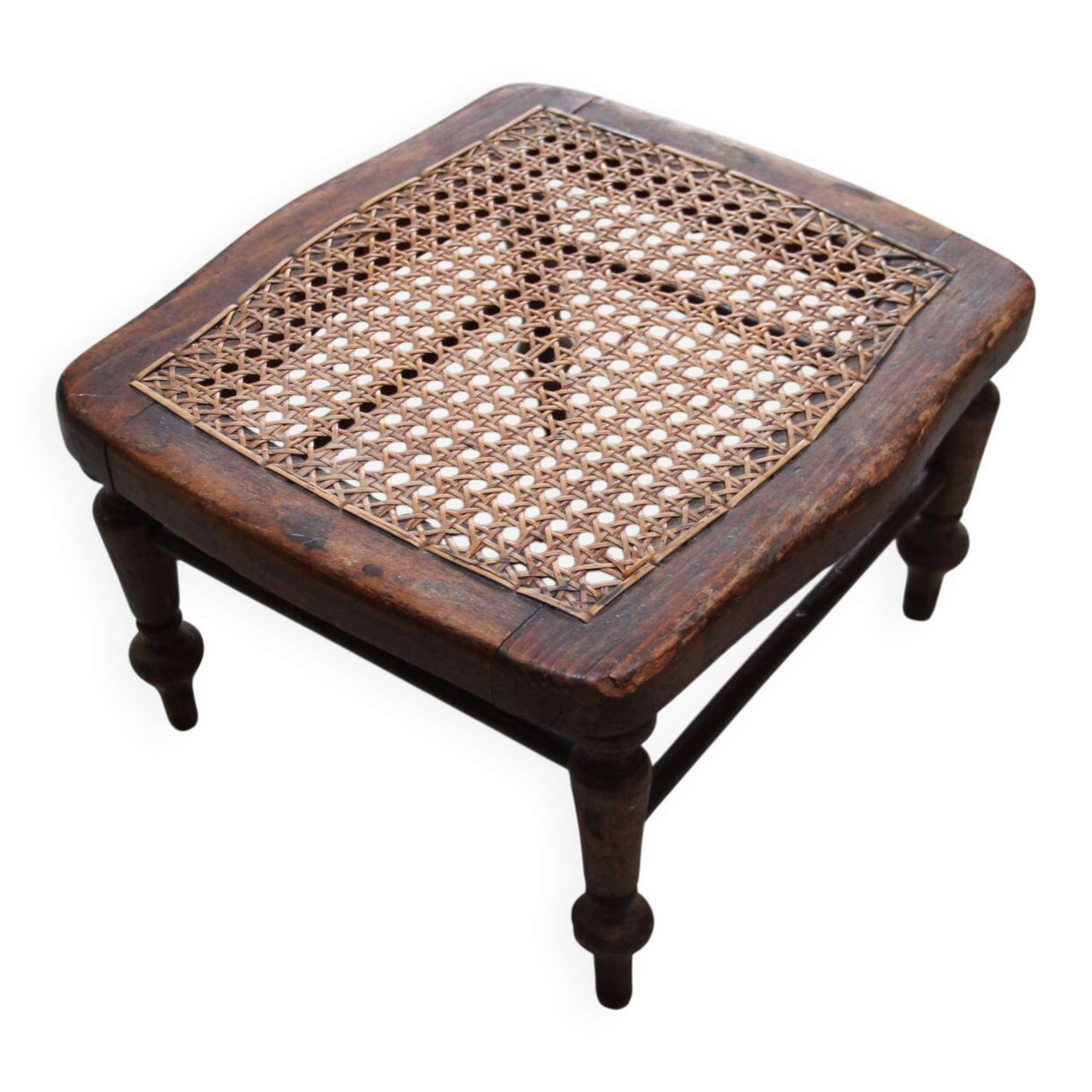 Antique caned wood footrest