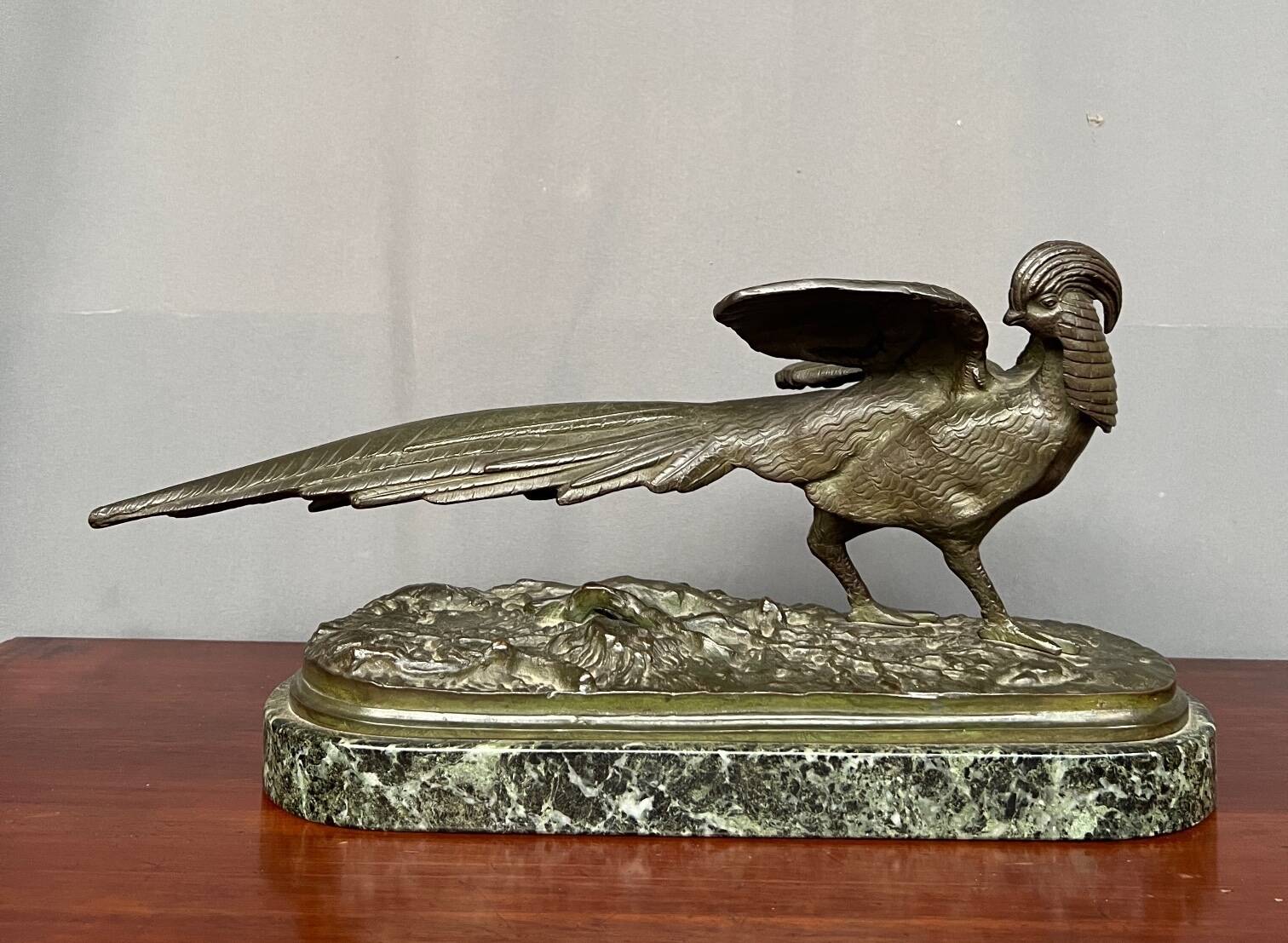 Rene Andre Varnier. Bronze figure of a pheasant on a green marble base.