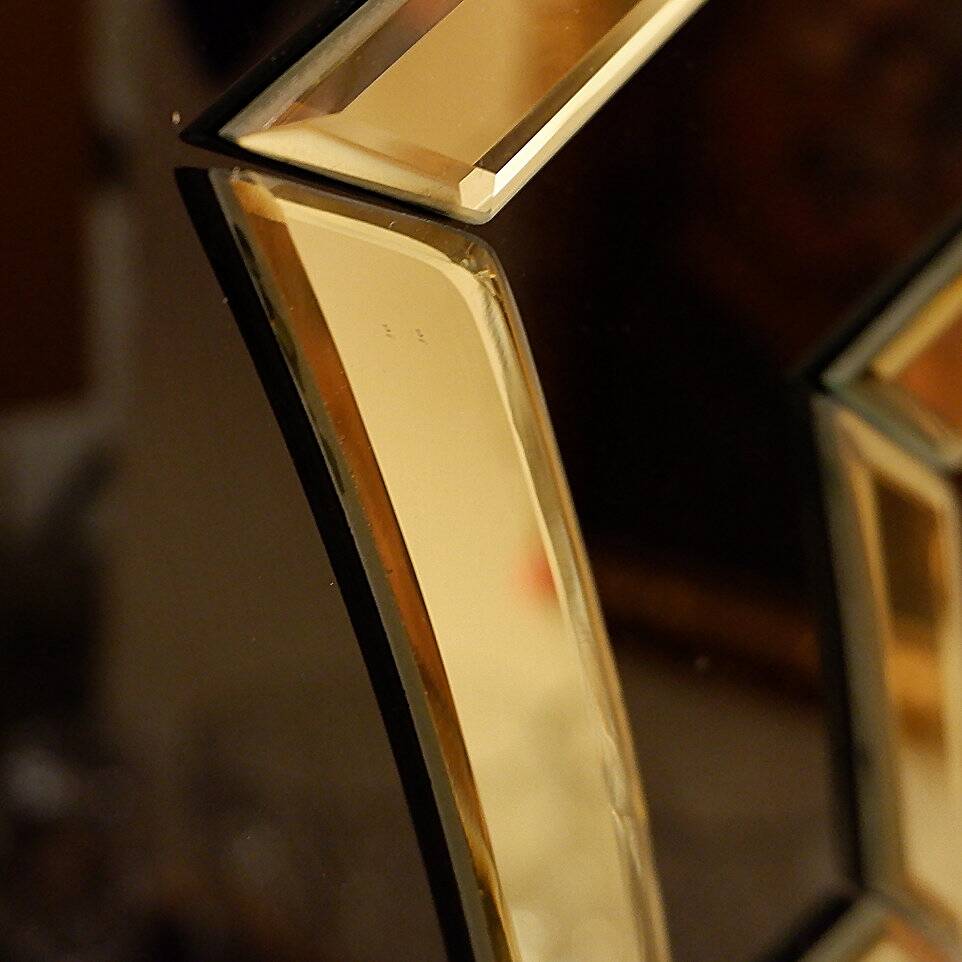 Pair of black and gold glass mirrors