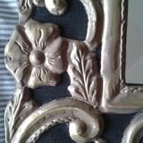Mirror with embossed metal décor