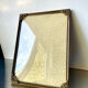 Metal frame in gold colored brass