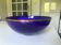 Blue fruit bowl with a golden rim by Lancel, diameter 26 cm.