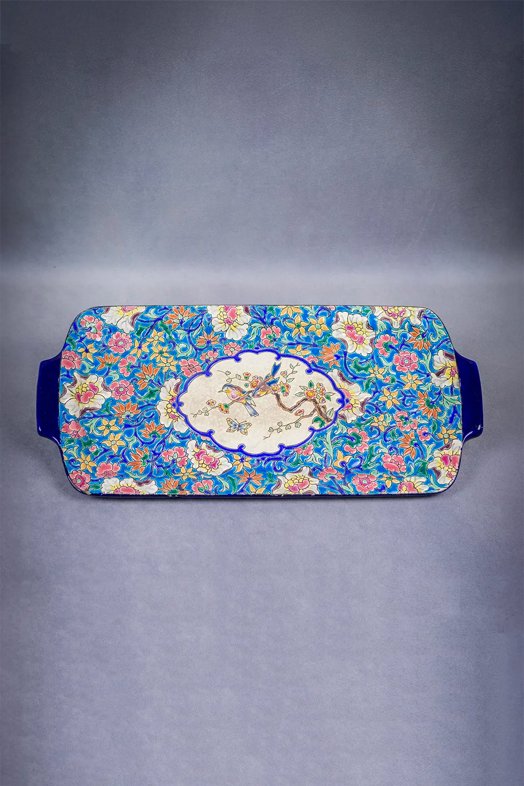 Plat à cake Longwy, décor floral et médaillon d’oiseaux, début XXème