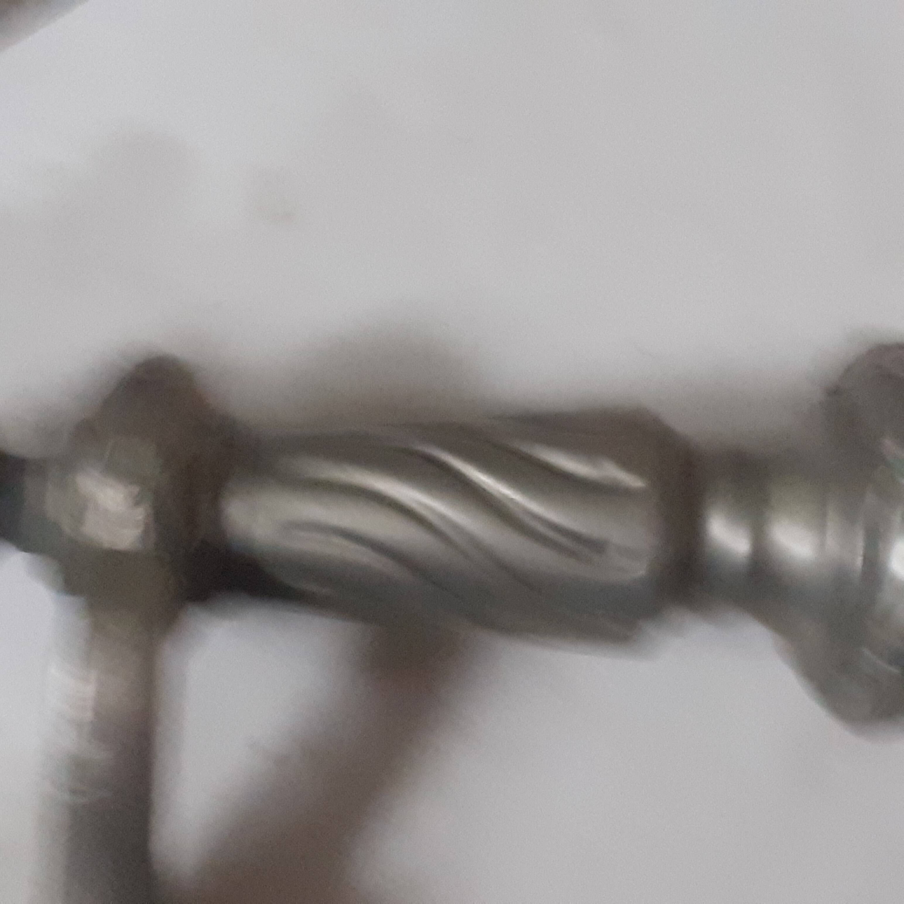 Entrance door handle in silvered bronze.