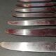 Old table knives and dessert knives, wooden handles, stainless steel blades