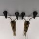A set of wall lamps in black lacquered metal with brass details