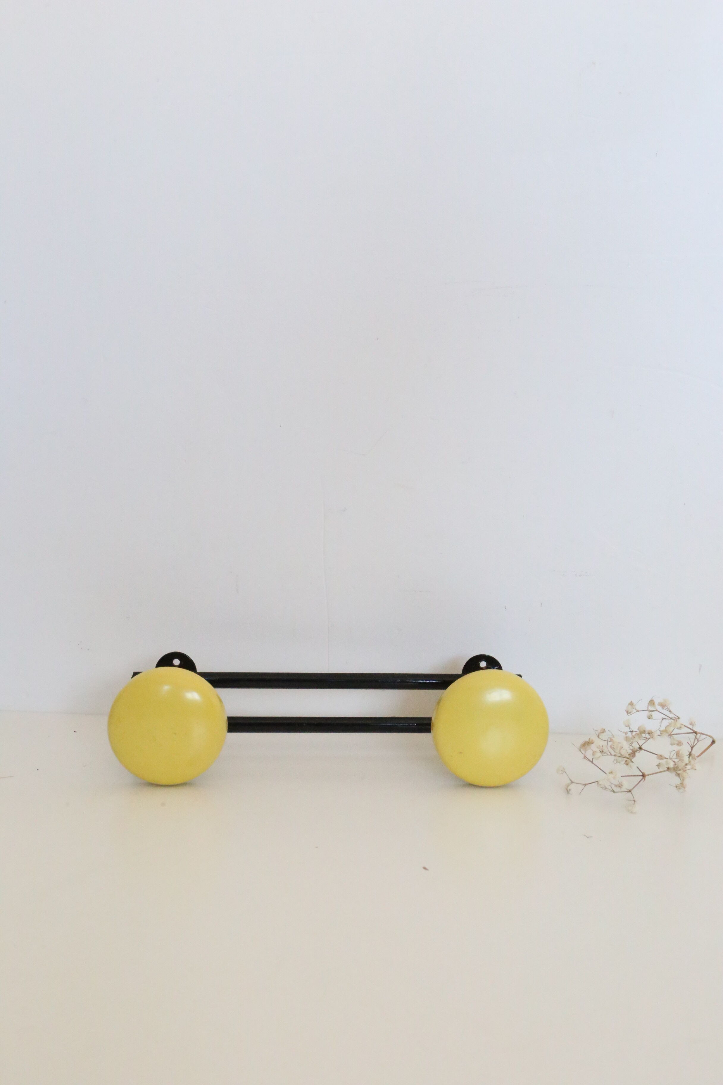 Wall coat rack in yellow and black metal, vintage