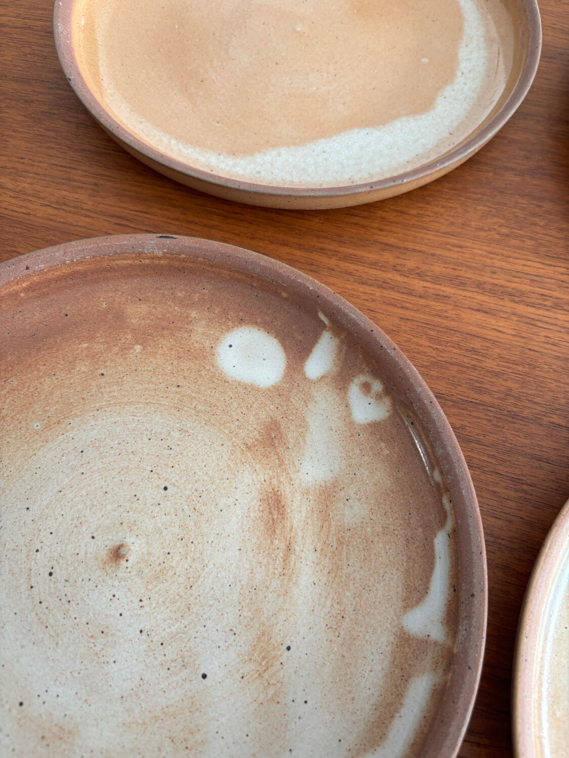 Set of vintage 1970s beige ceramic dinner plates.