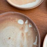 Set of vintage 1970s beige ceramic dinner plates.