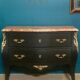 Louis XV style curved black matte commode with gilded bronze ornamentation from the 1950s.