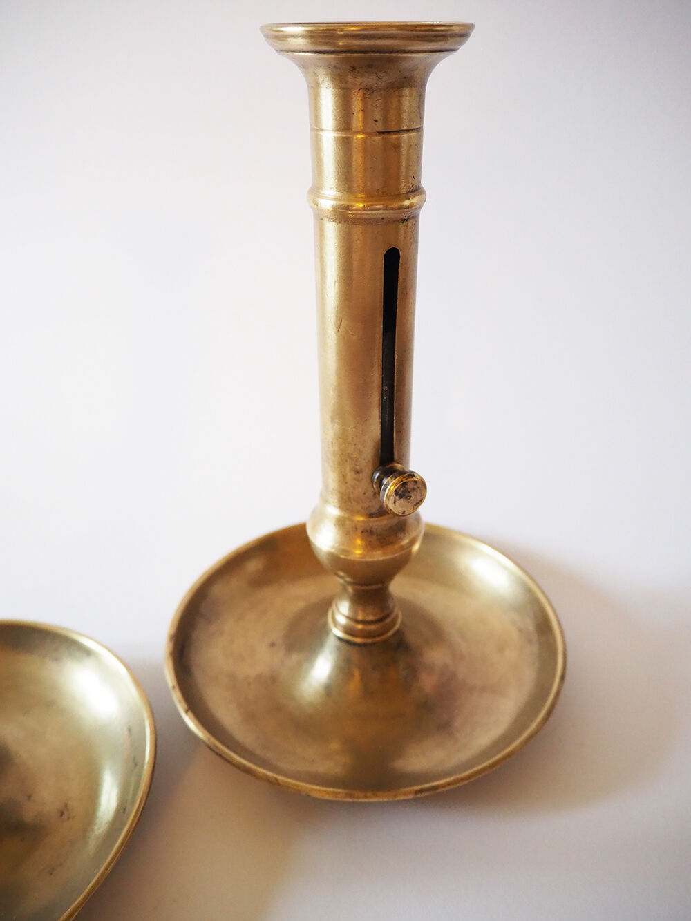 Set of three old brass candle holders