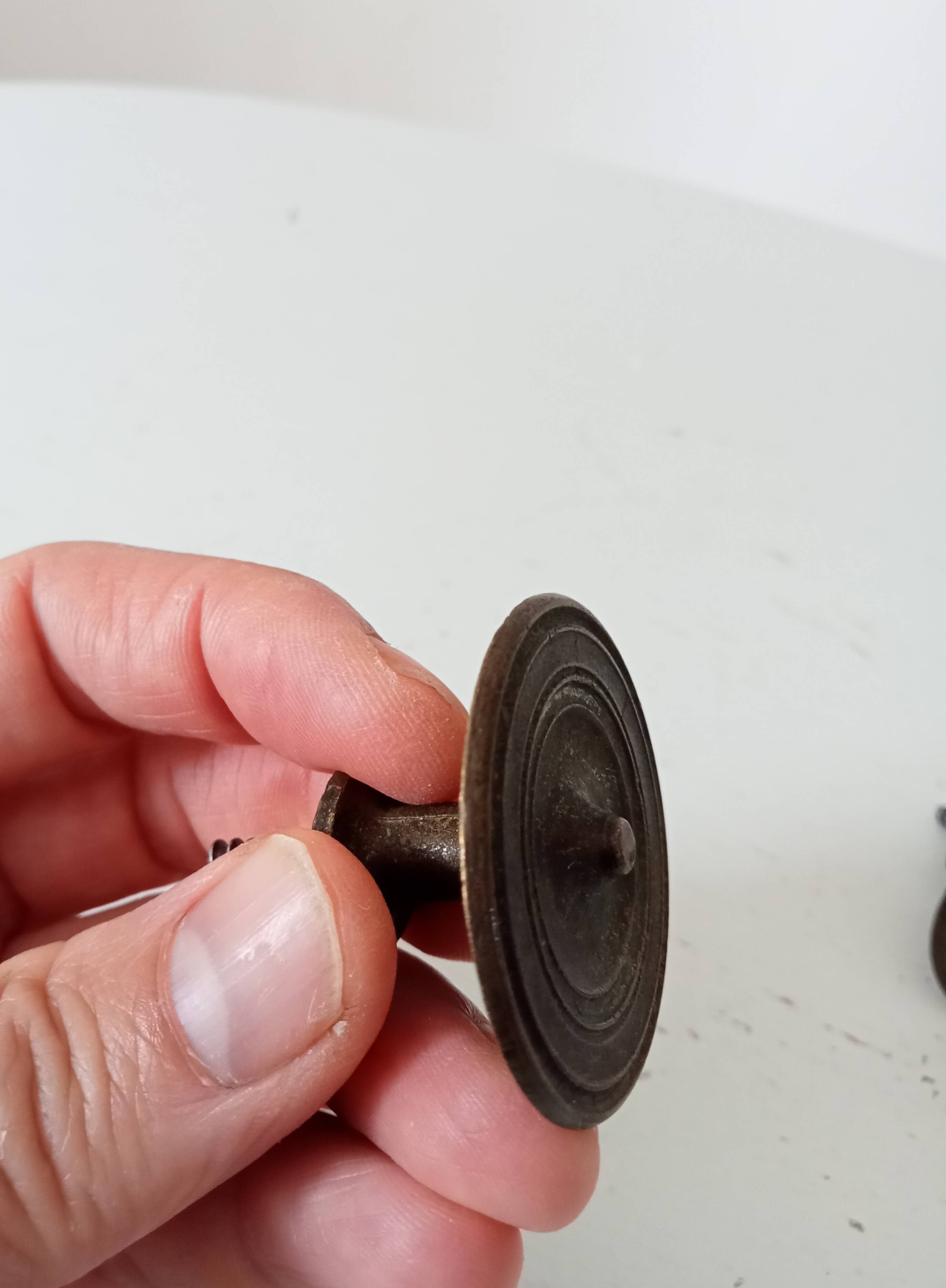 Pair of antique Empire furniture knobs from the 19th century.
