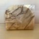 Asymmetrical marble ashtray emptier
