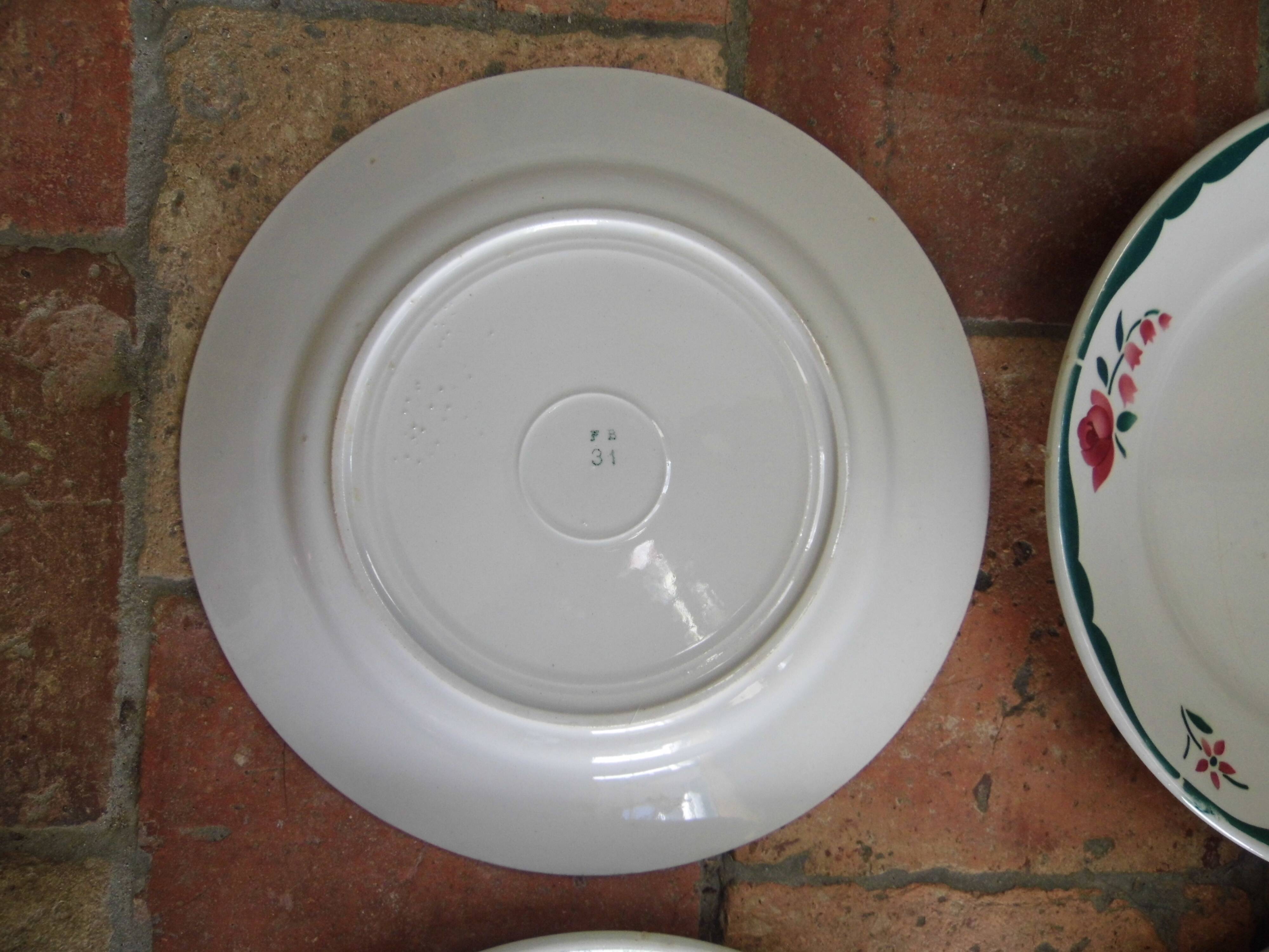 4 plates in faience of Badonviller F.B, floral motif, 20s