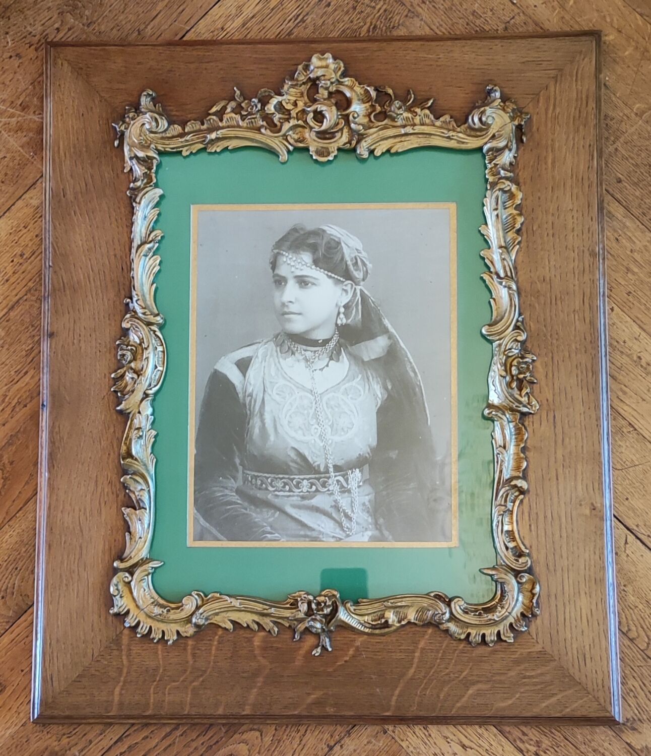 Old wooden frame and bronze ornament