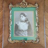 Old wooden frame and bronze ornament