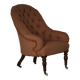 Victorian mahogany armchair, with wheels and coloured fabric, England, early 1900s.