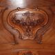 Walnut rocaille bed from the early 20th century.