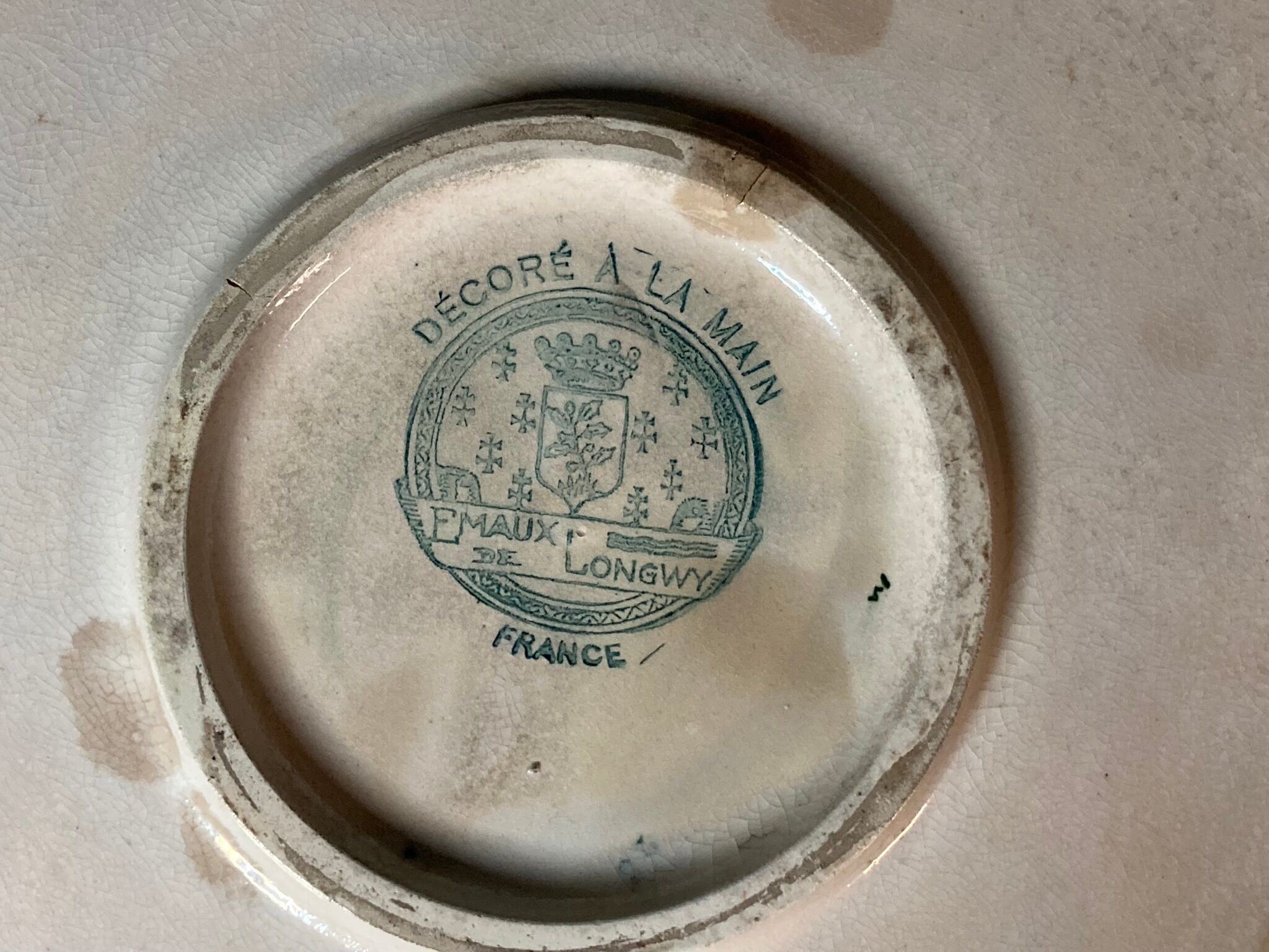 Round polychrome enamel dish with bird decoration circa 1900