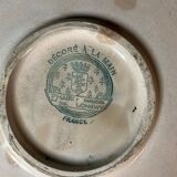 Round polychrome enamel dish with bird decoration circa 1900