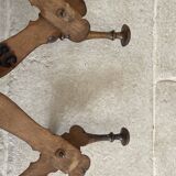 Wall-mounted accordion coat rack made of turned wood