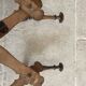 Wall-mounted accordion coat rack made of turned wood