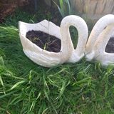 Swan-shaped garden vases in reconstituted stone