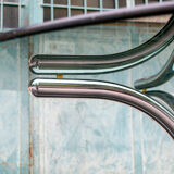 Round table in chromed metal and glass Italia Anni '60