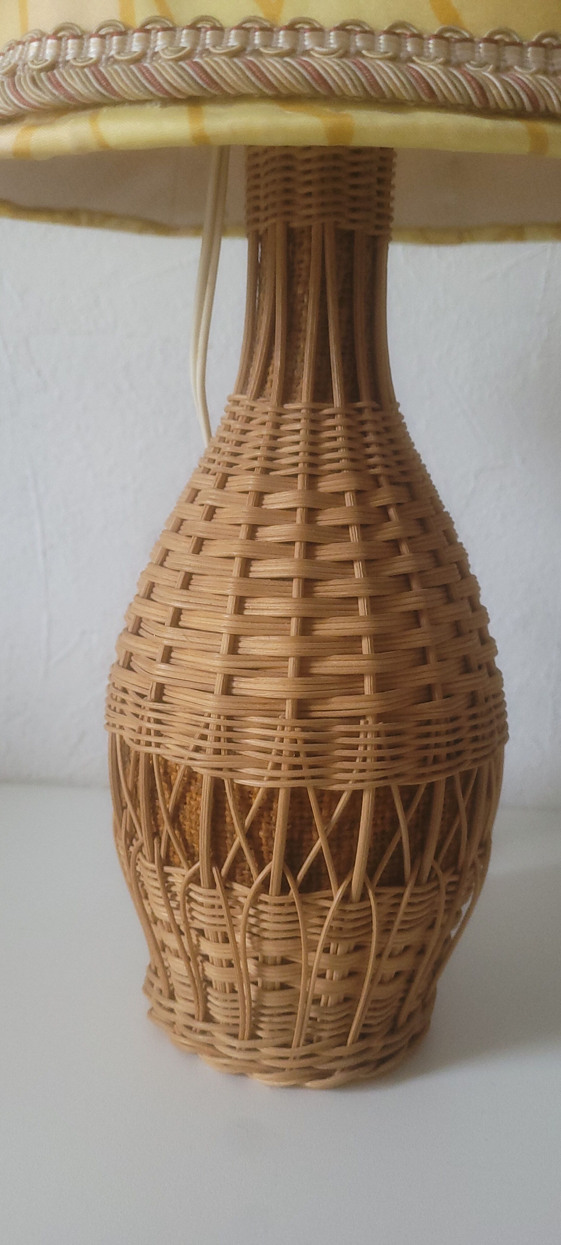 Vintage rattan lamp with yellow shade
