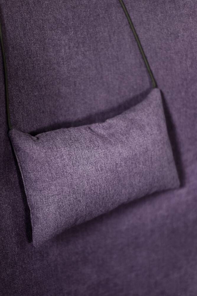 High-backed wing chair in oak and purple fabric, vintage Scandinavian style from the 1950s.