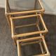 Trio of vintage pull-out tables in rattan and smoked glass 70s