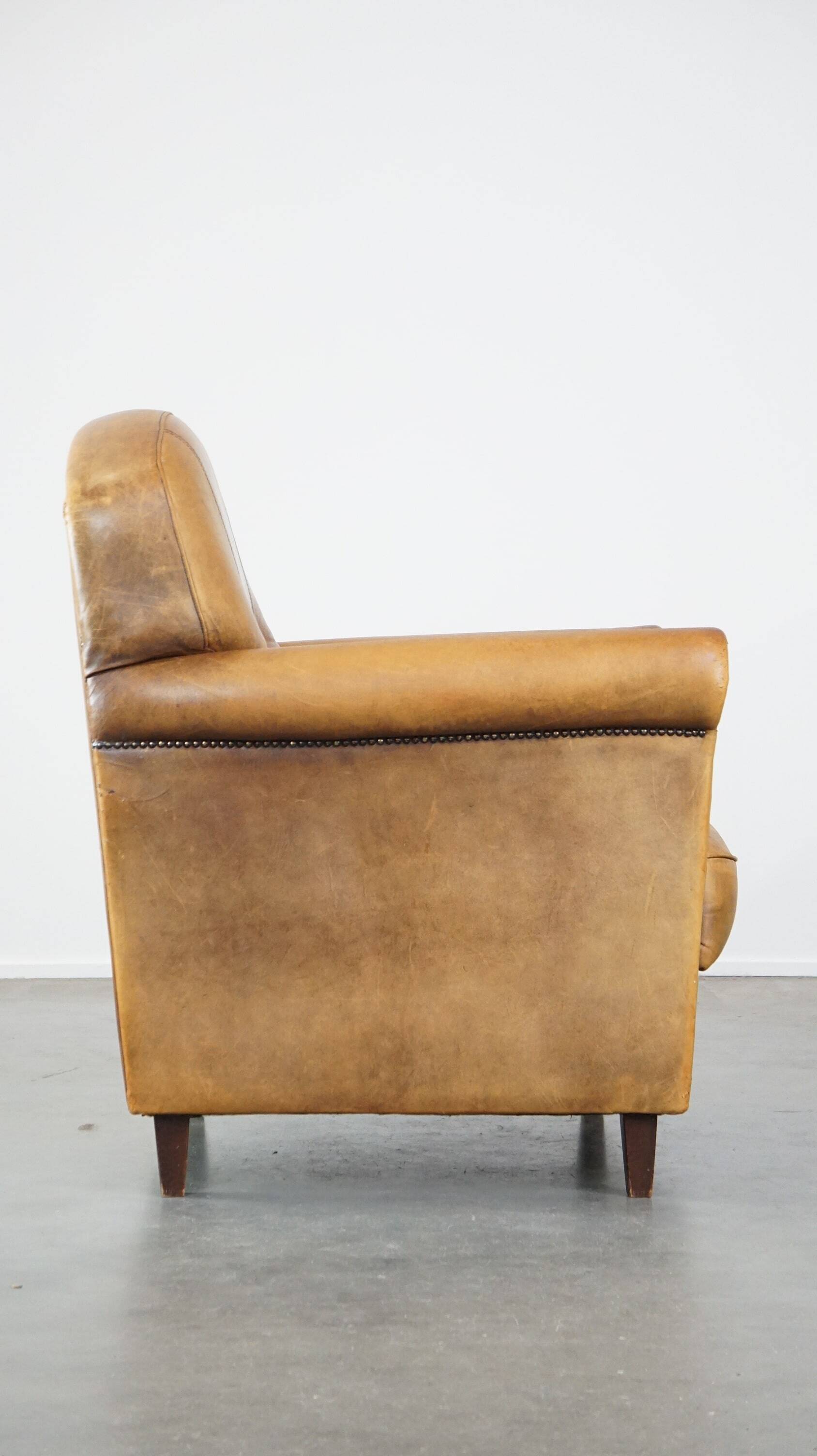 Stately, sleekly finished, comfortable sheepskin armchair