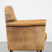 Stately, sleekly finished, comfortable sheepskin armchair