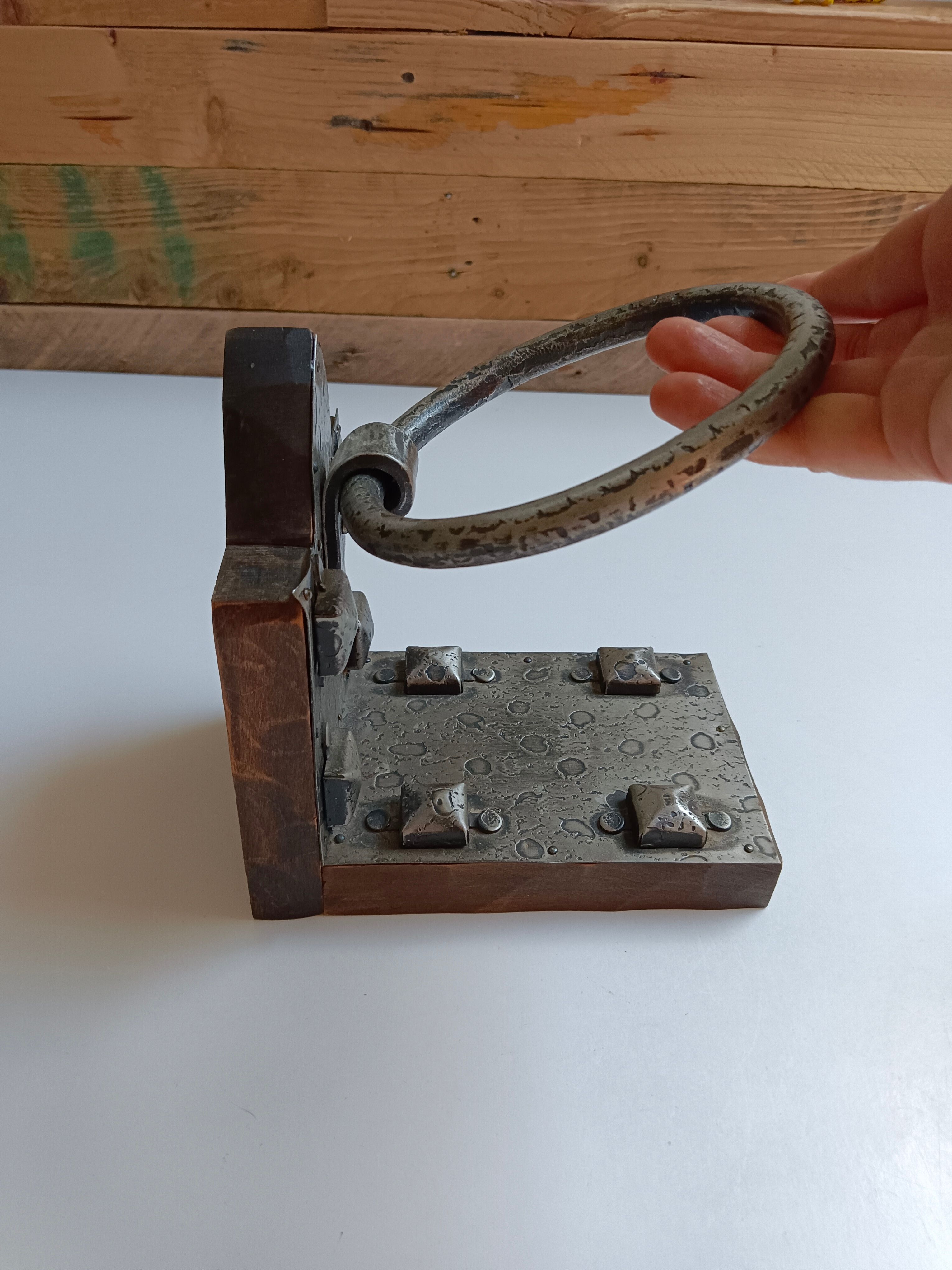 Medieval-style bookends, antique door handle.