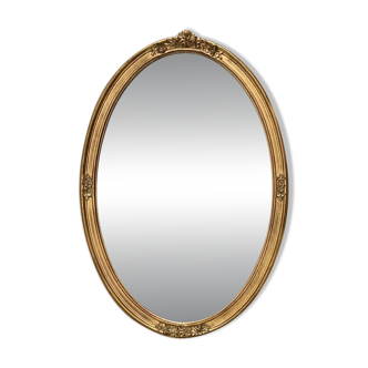 Oval mirror in carved wood